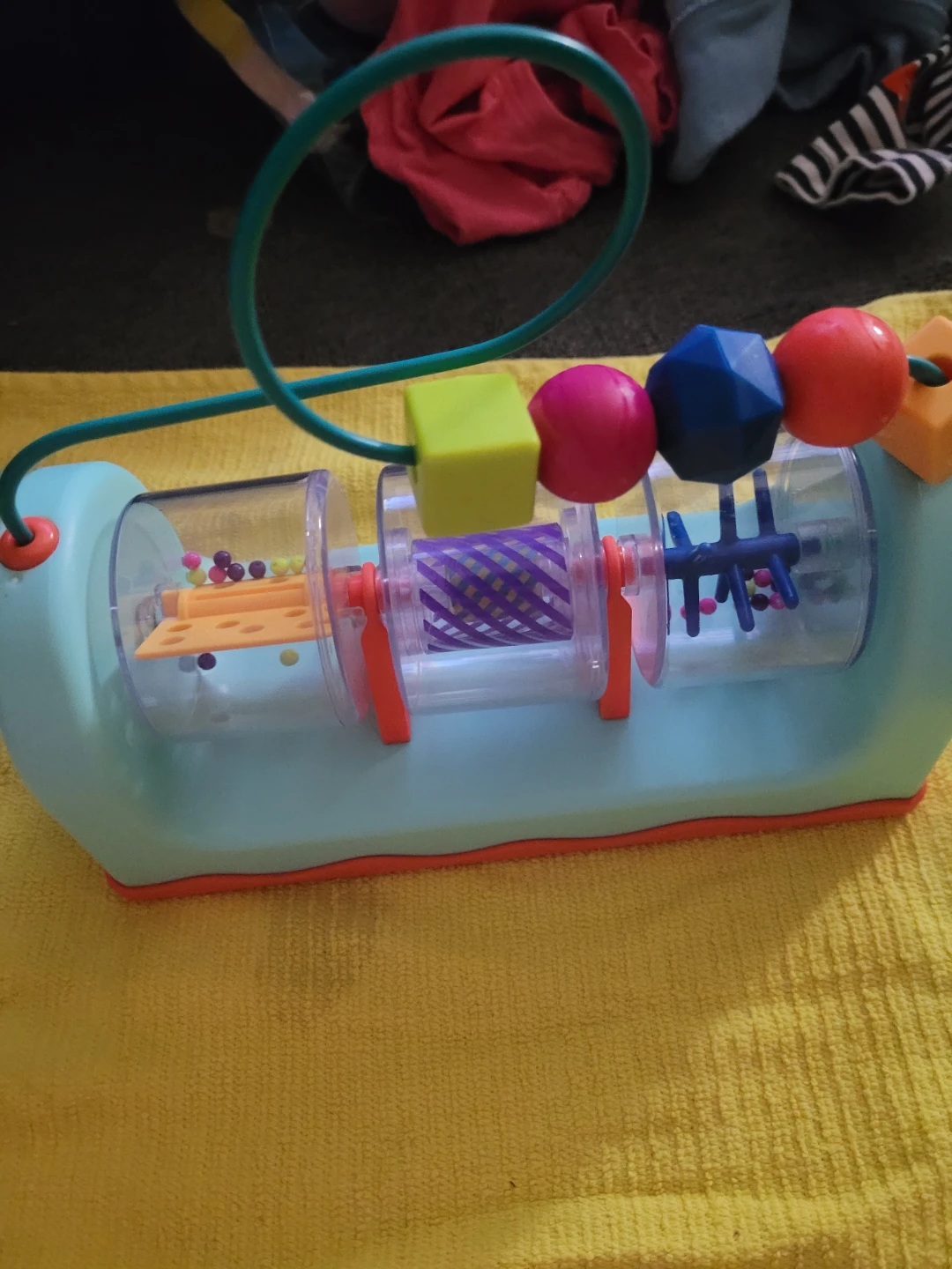 B. toys Spin, Rattle & Roll baby activity station.