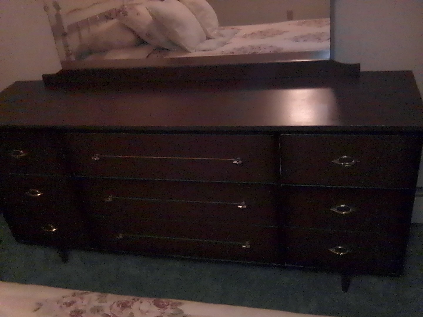 Dark wood bedroom dresser with mirror