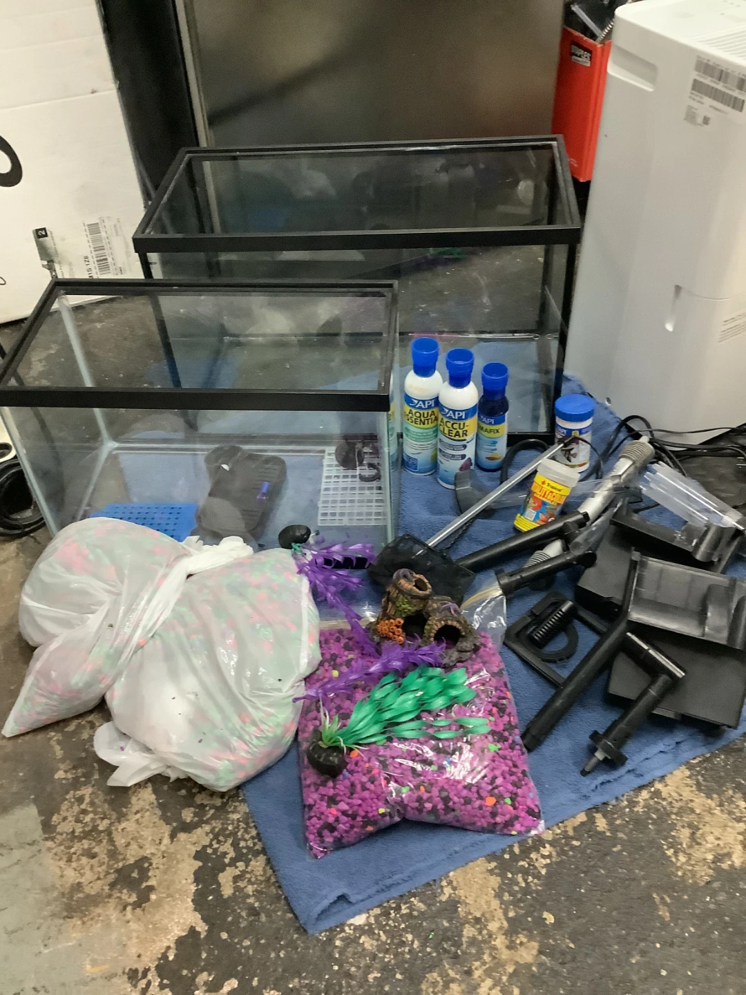 Two glass fish tanks with aquarium accessories