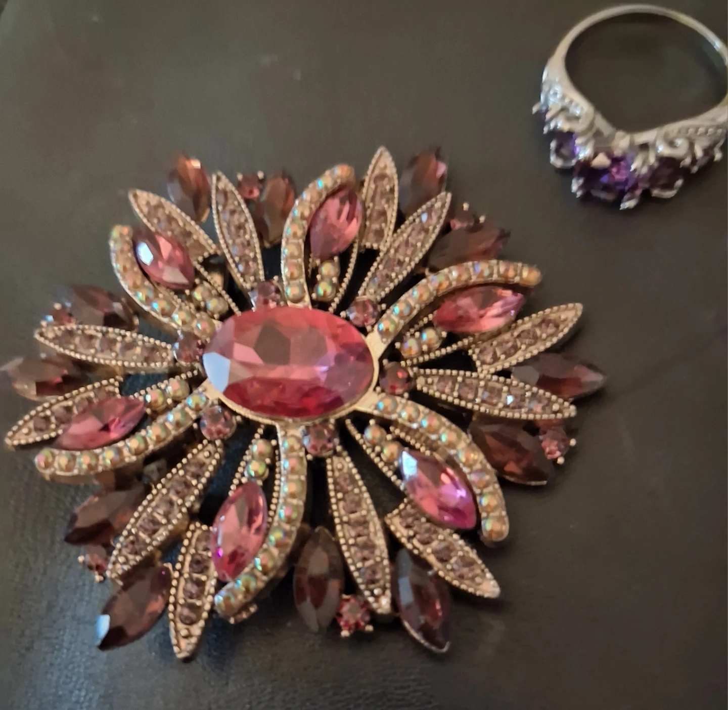 Vintage-style flower brooch with purple and pink crystals
