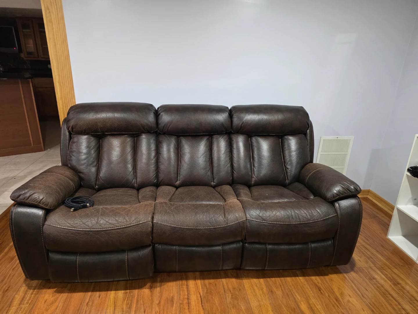 Dark Brown Leather Reclining Sofa and grey sofa comebed