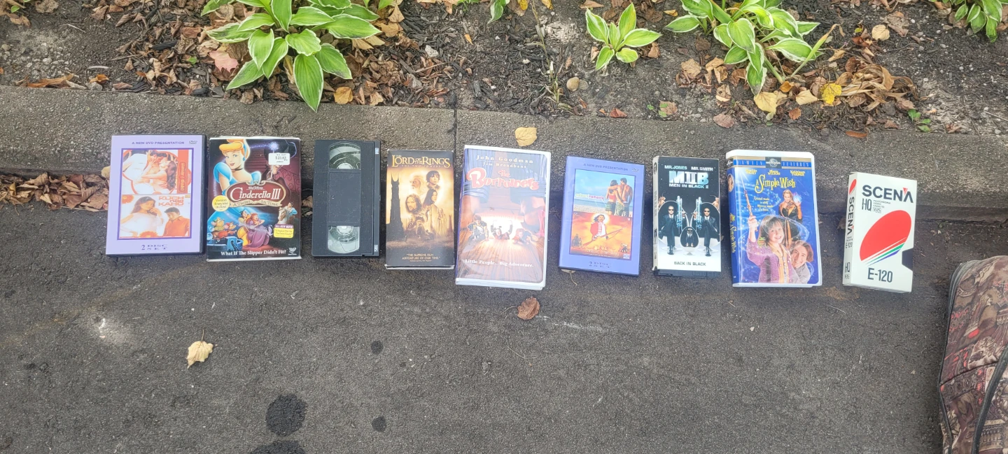Large Duffel Bag with Assorted VHS Tapes and DVDs
