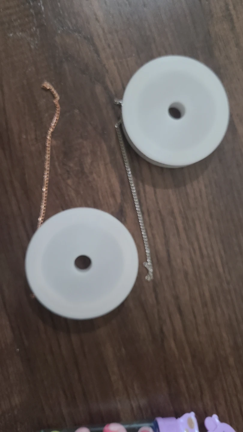 Two decorative chain spools