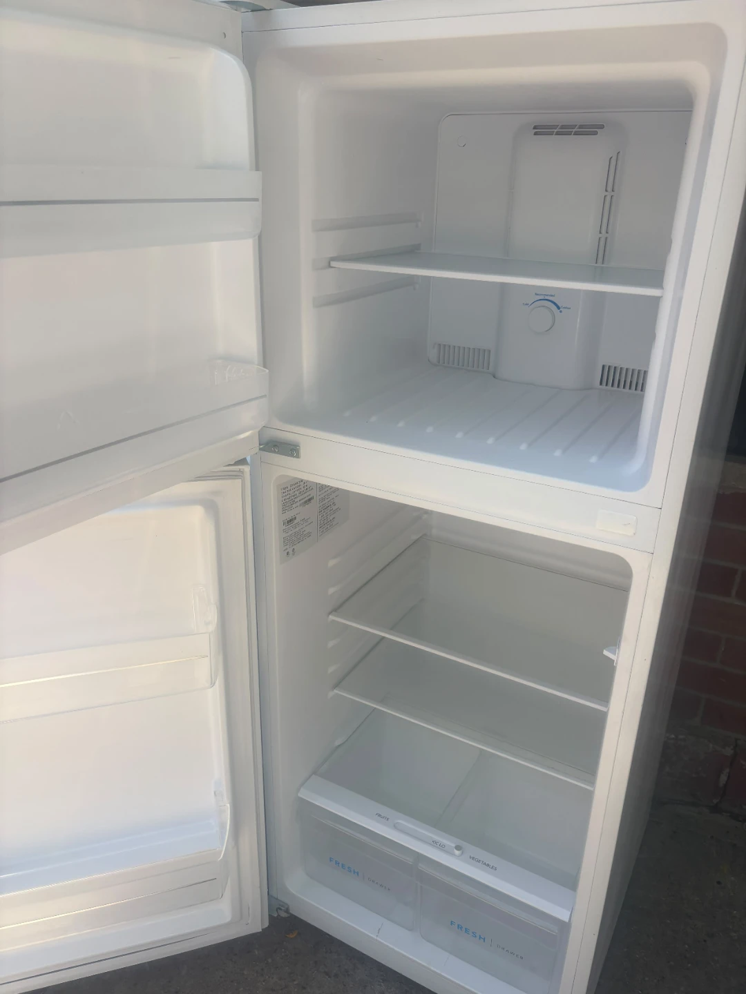 Frigidaire 24in Refrigerator and Hotpoint Electric Range - photo 2
