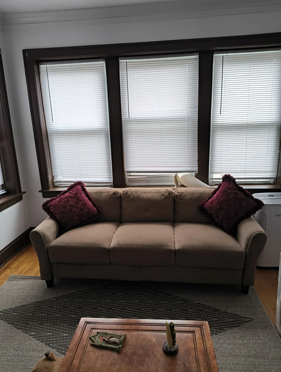 Three-seater beige sofa