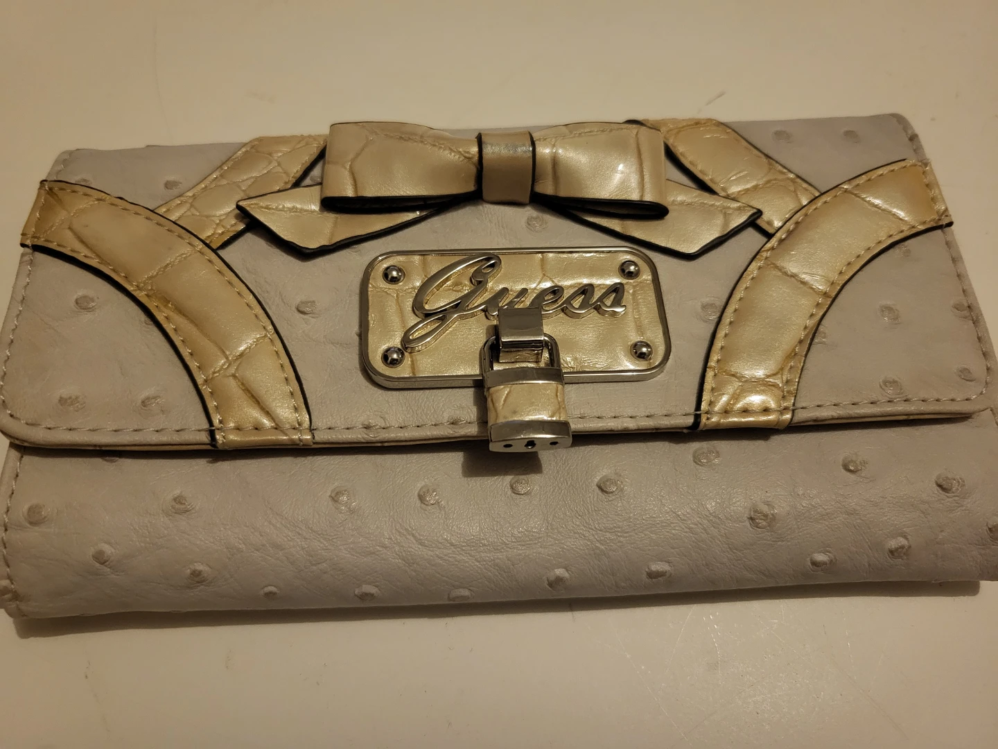 Guess clutch wallet with bow detail