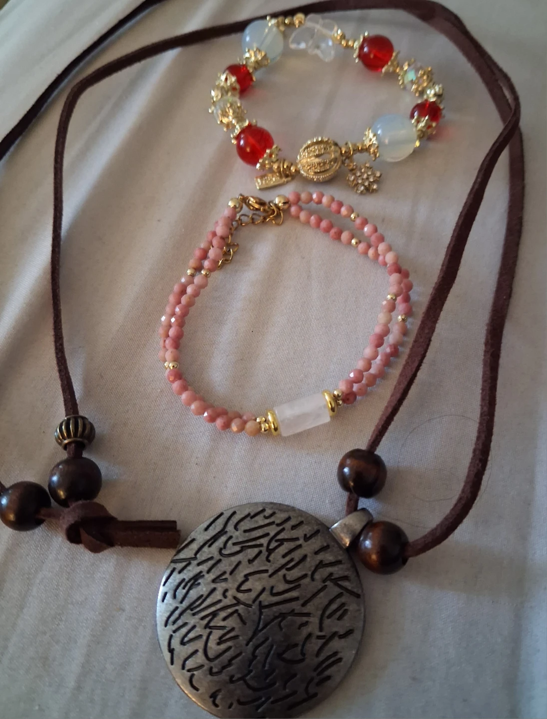Set of three beaded bracelets and necklace
