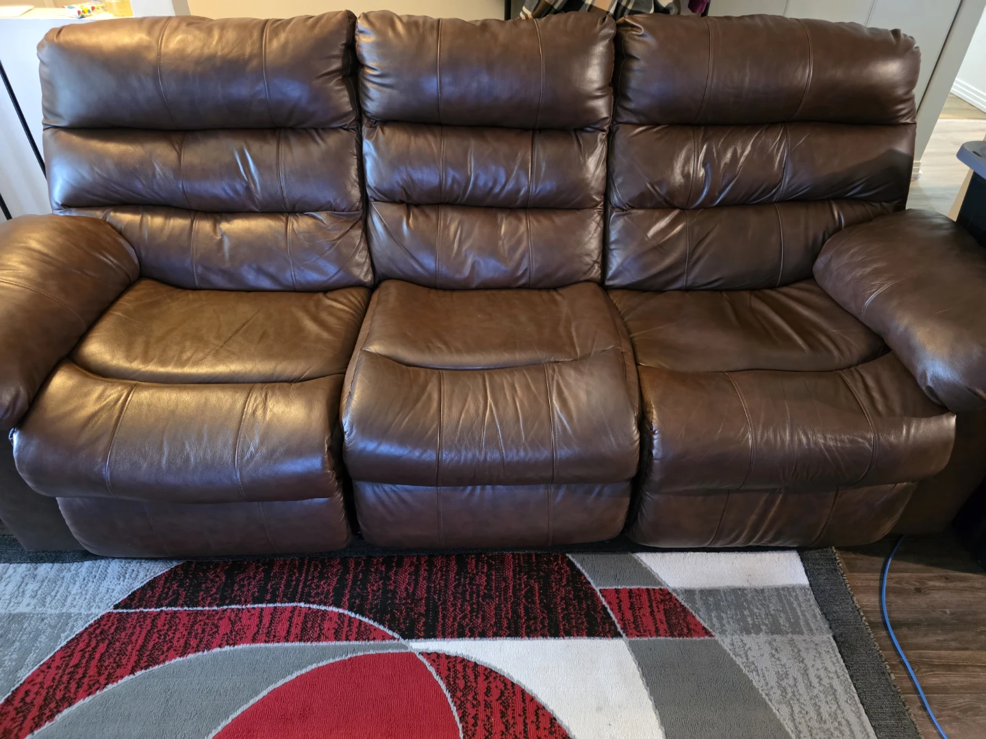 Brown Leather Reclining Sofa