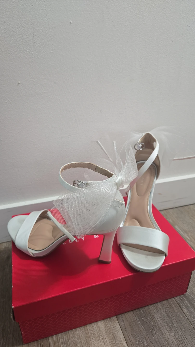White satin heels with bows
