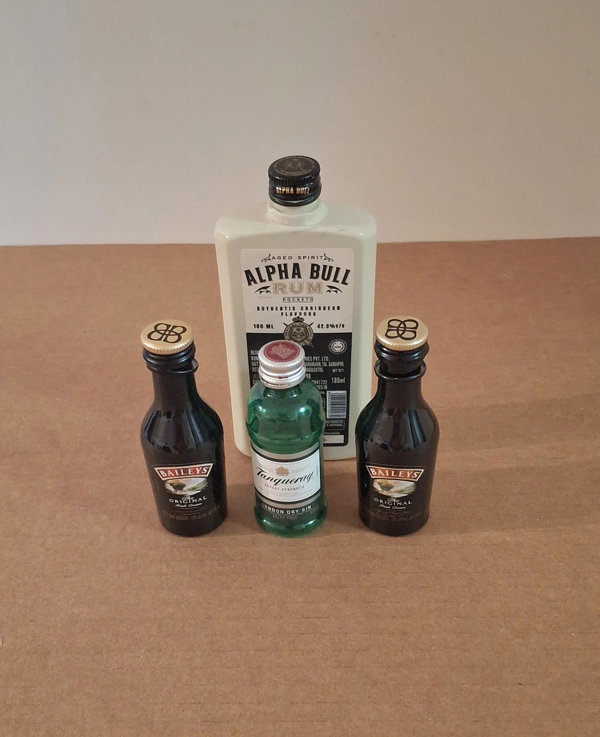 4 Miniature Bottle Collectibles