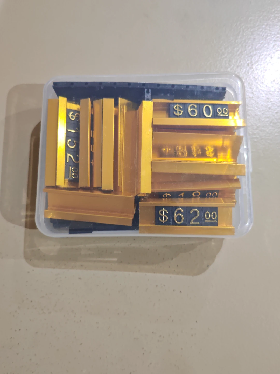 Gold and black price tag display blocks