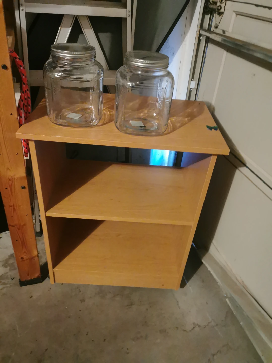 Small light brown wooden shelving unit