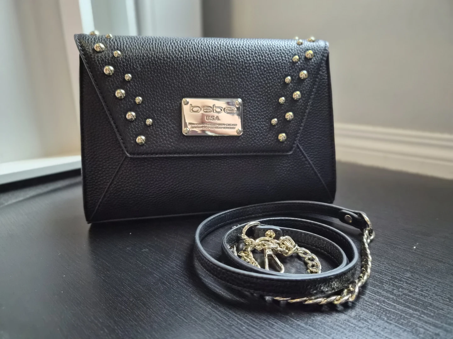 bebe studded clutch/purse