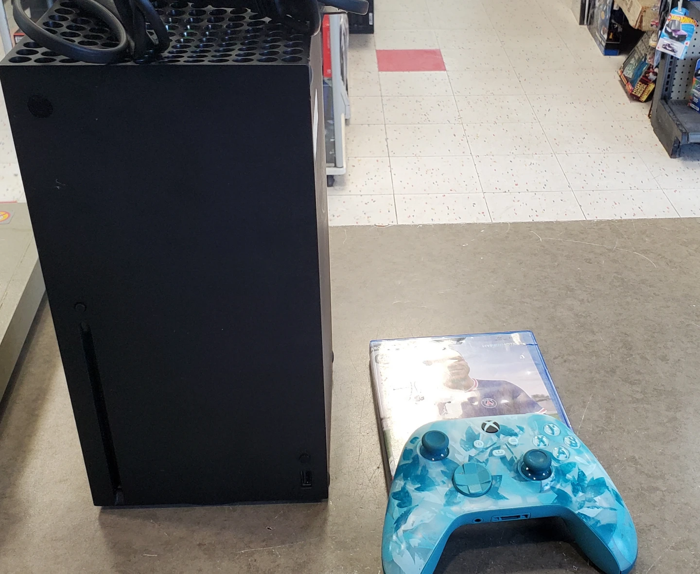 Xbox Series X console with controller and FIFA 22 game