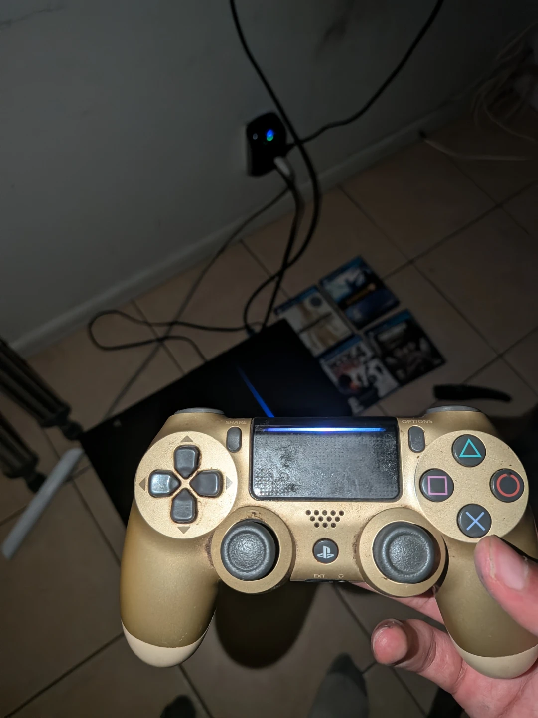 PlayStation 4 with Wires and Gold Controller