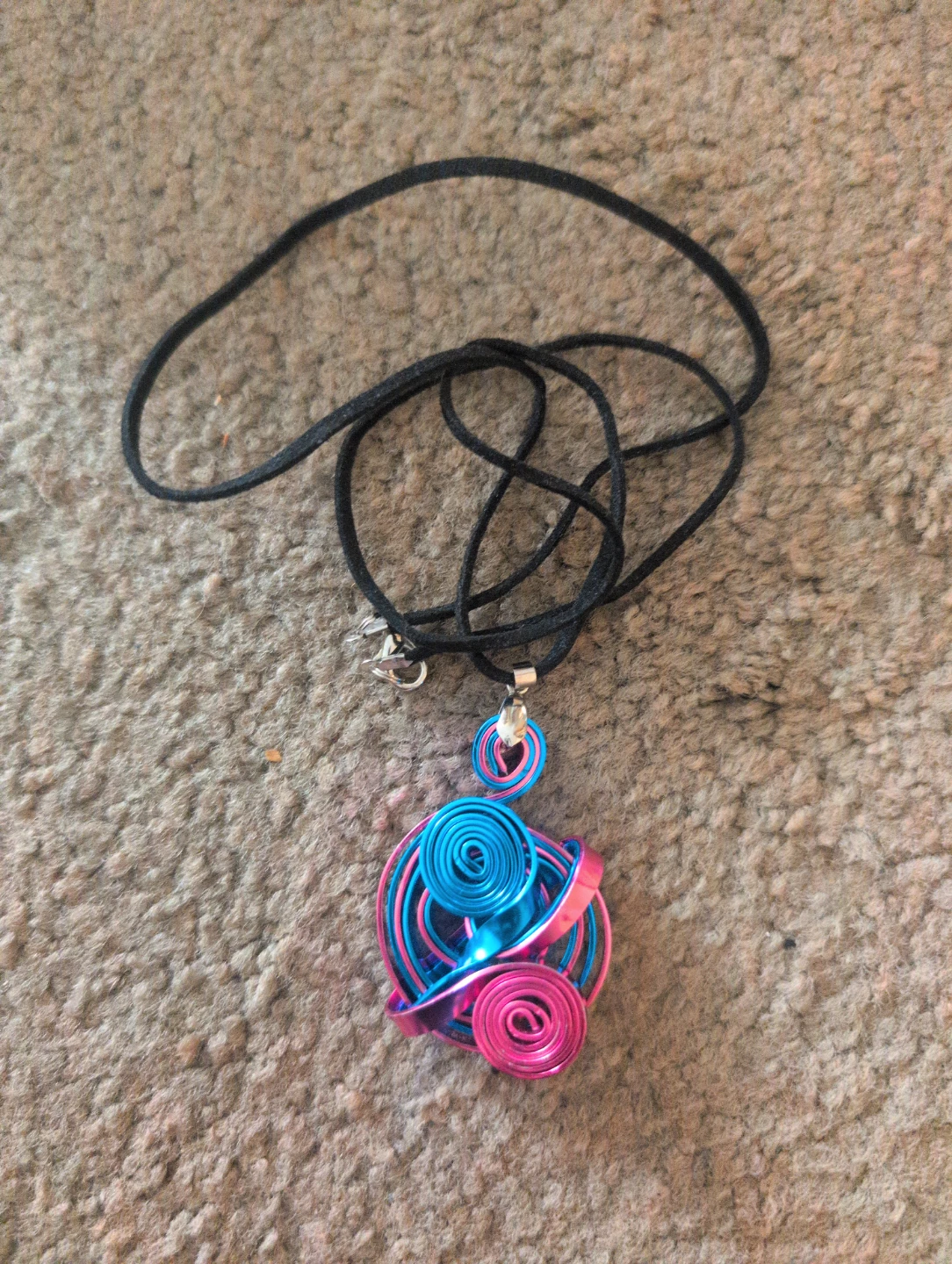 Blue and pink wire spiral pendant necklace