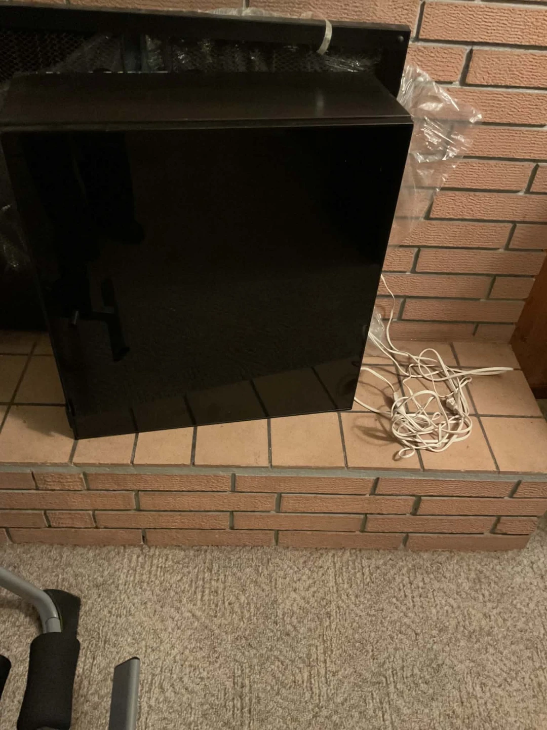 Black wall-mounted cabinet with glass door