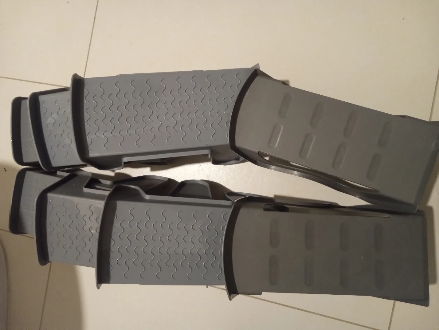Four pairs grey plastic shoe stackers $10, moving sales.