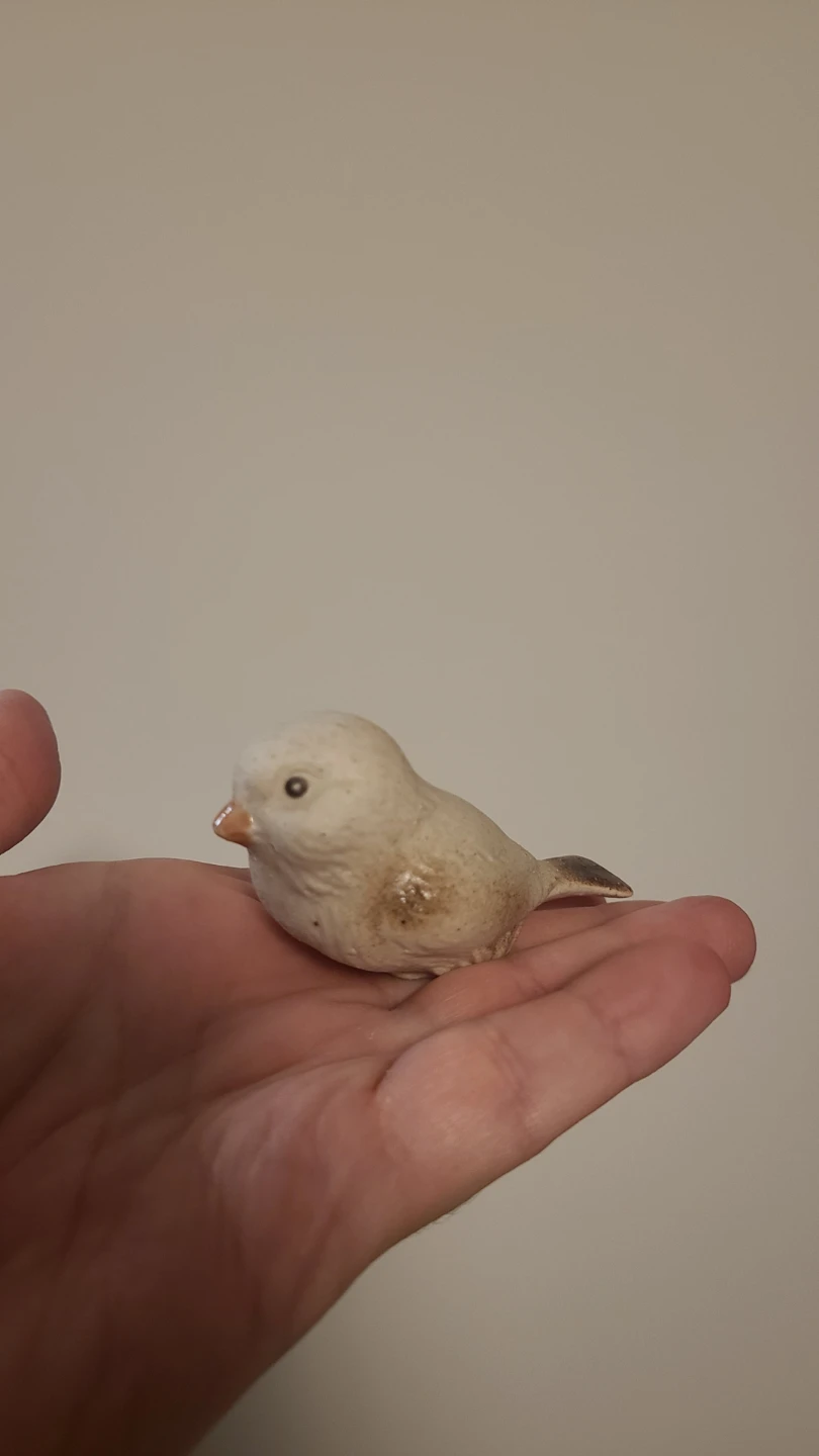 Small ceramic bird figurine