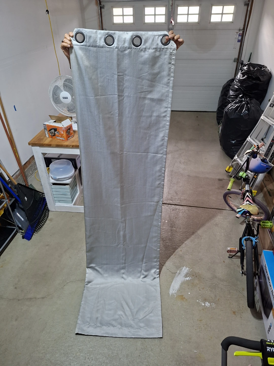 Single grey grommet curtain panel