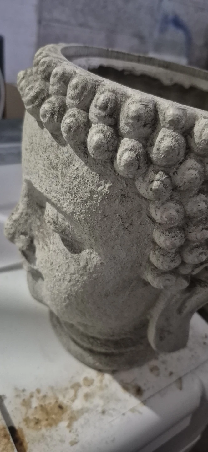 Stone-look Buddha head planter