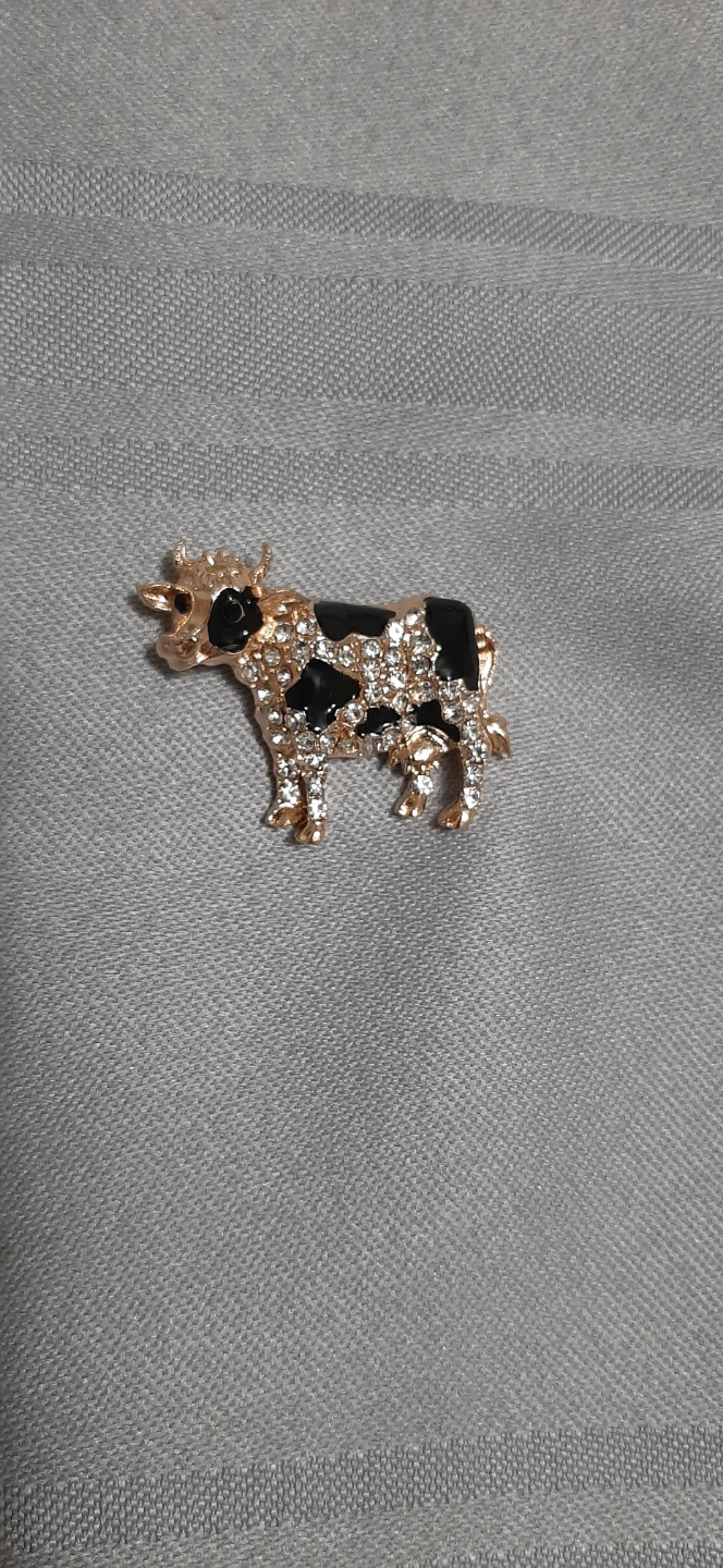 Gold & black cow shaped brooch with rhinestones.