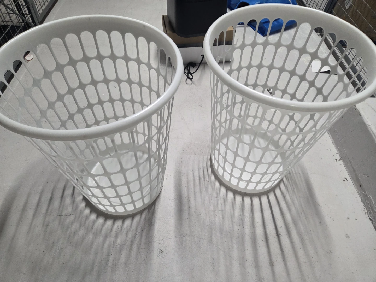 Two white plastic laundry hampers - photo 4