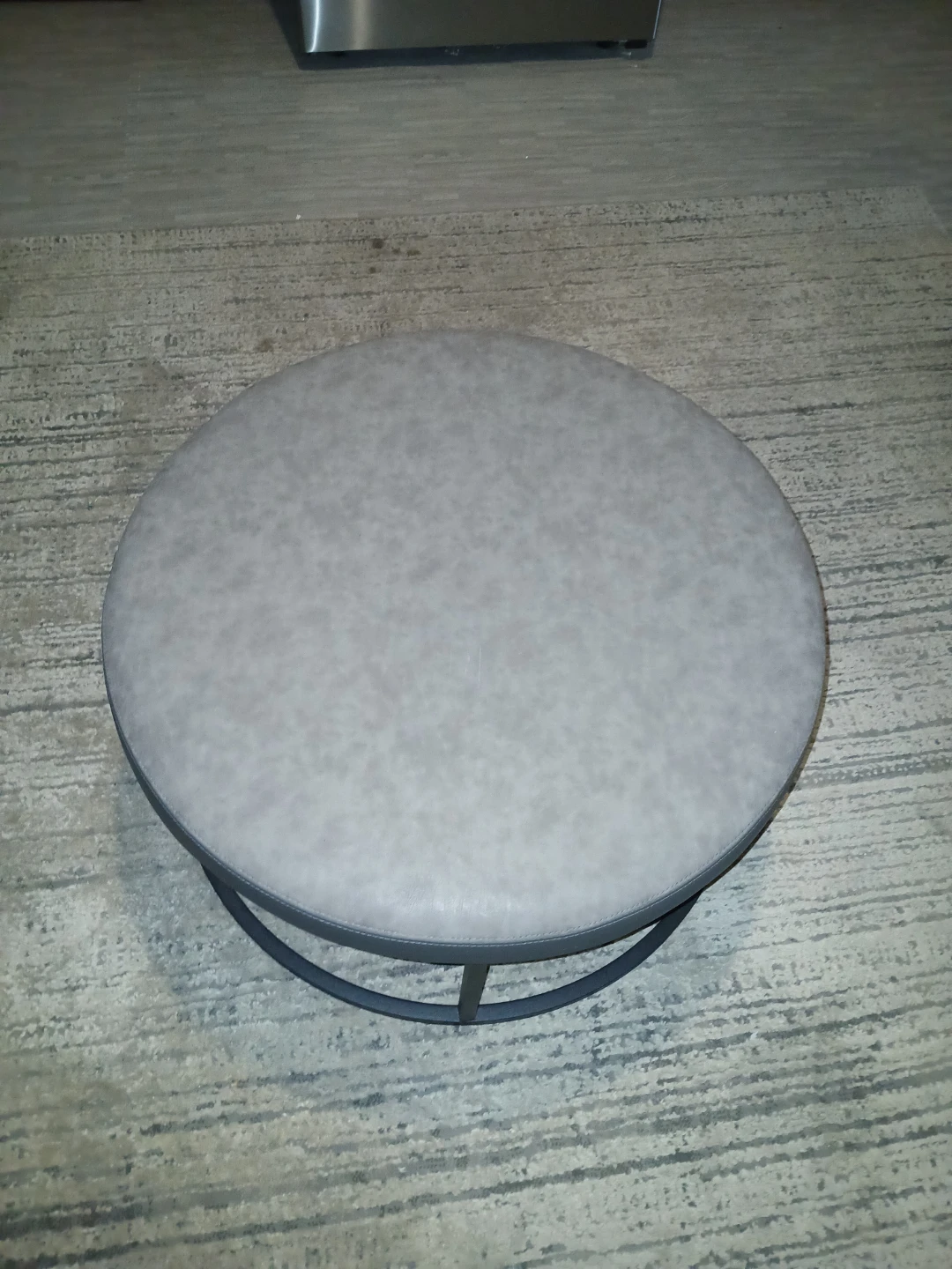 Round Gray Faux Leather Ottoman