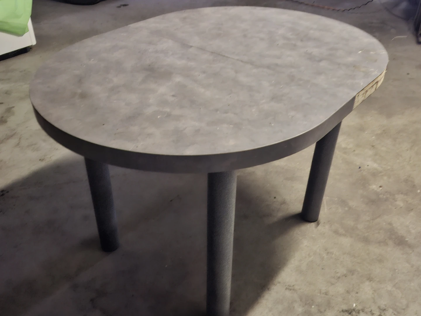 Round grey laminate dining table