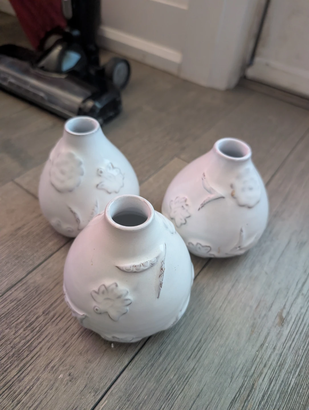 Set of three white ceramic bud vases
