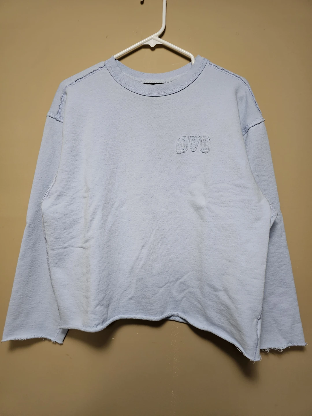 October’s Very Own (OVO) Cropped Raw-Hem Sweatshirt – Light Blue