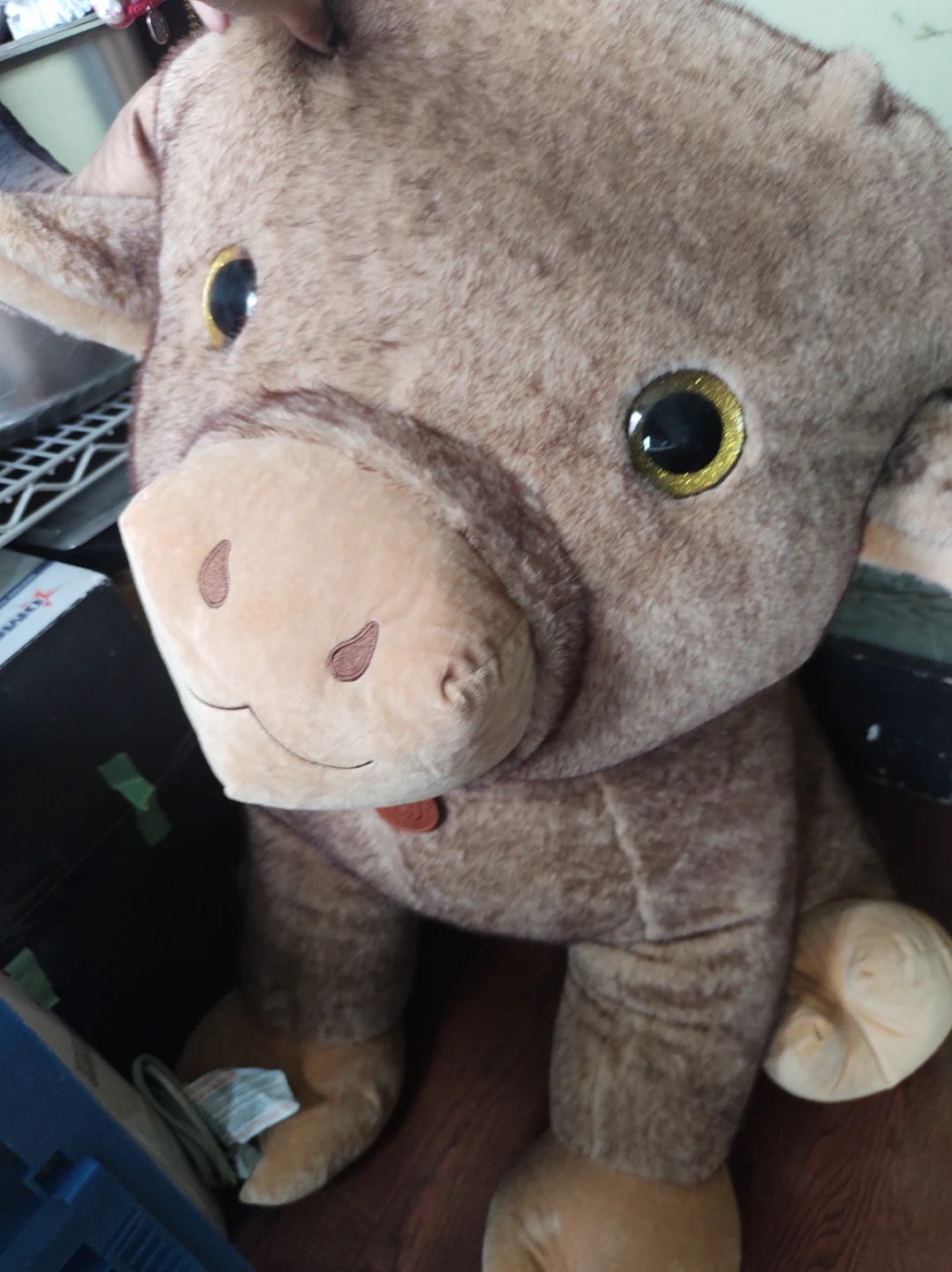 Large plush brown bull toy