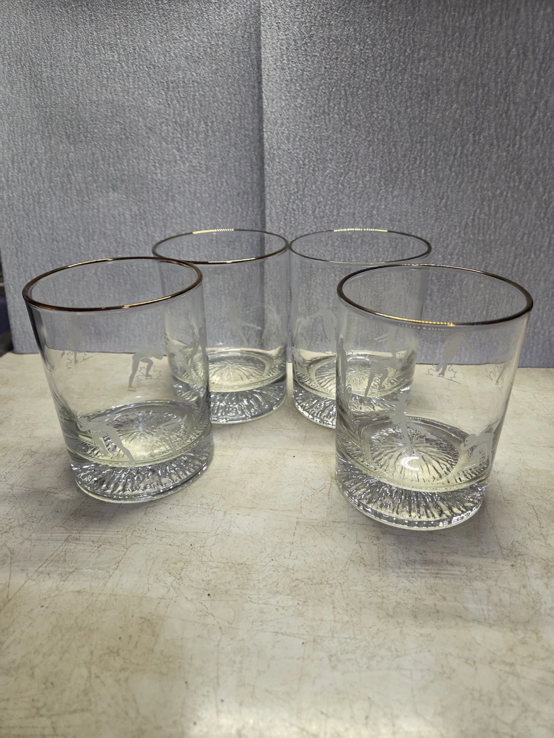 Set of 4 1988  Olympic gold rimmed  glasses