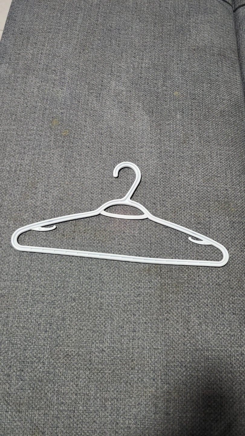White plastic clothing hanger