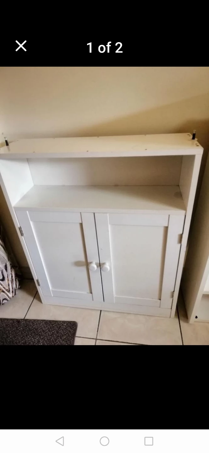 White storage cabinet with open shelf