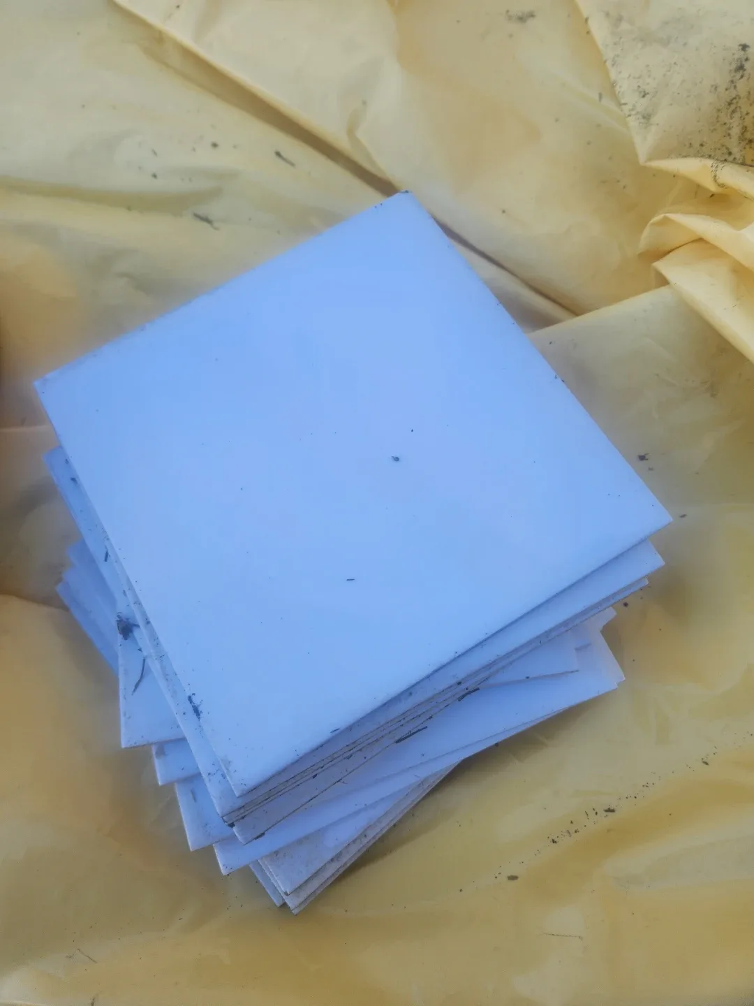 Stack of White Ceramic Tiles