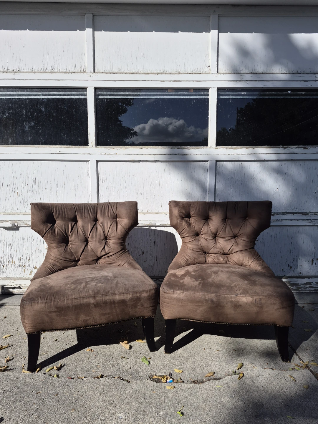 Two Brown Tufted Accent Chairs