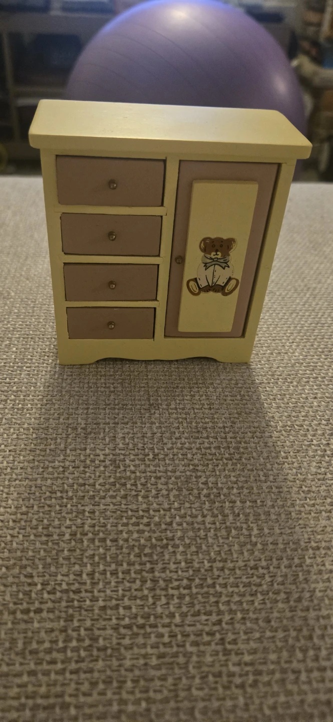 Miniature wooden dresser with bear design