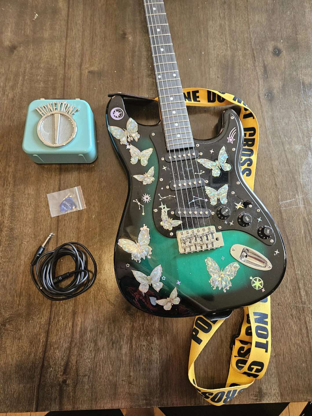 Electric Guitar with Butterfly Stickers and Mini Amp