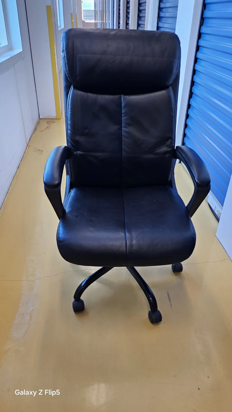 Black office chair available immediately.