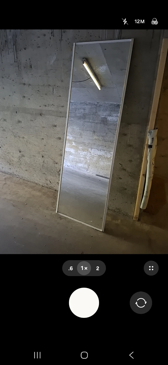 Full length white framed mirror