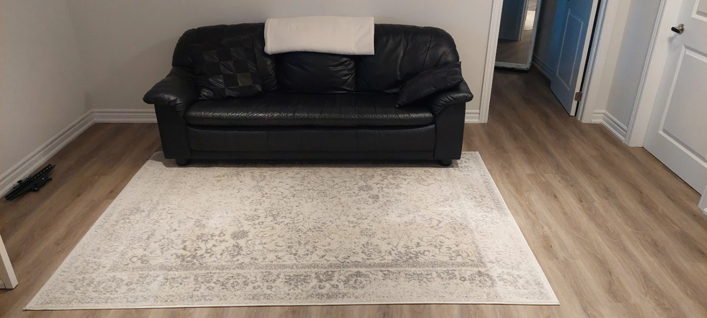 Black Leather Three-Seater Sofa pick up in Welland.