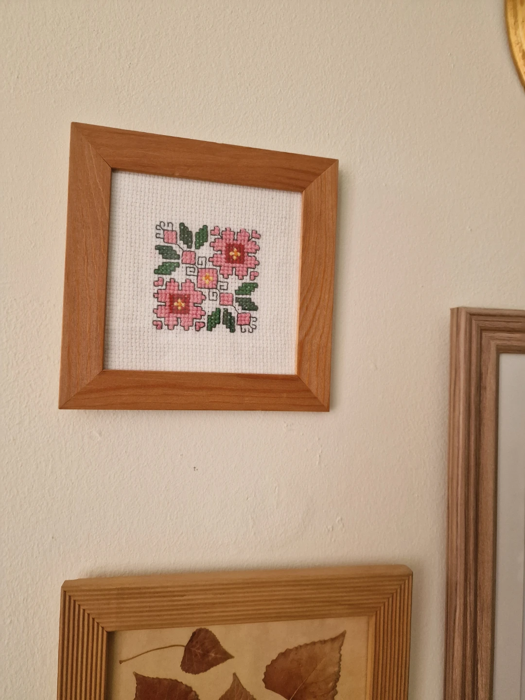 Framed floral cross-stitch wall art