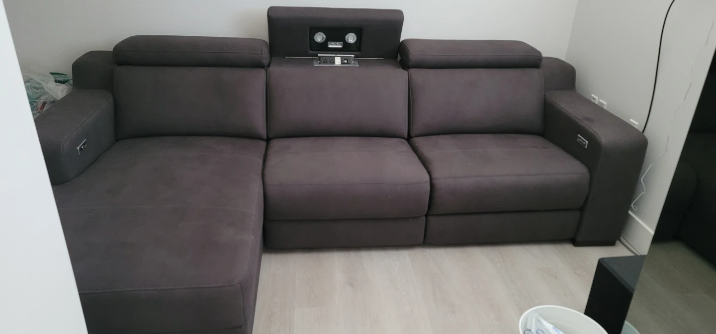 Dark grey sectional sofa with built-in speakers