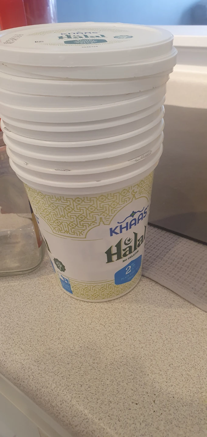 Empty glass jar and stack of plastic yogurt containers - photo 2