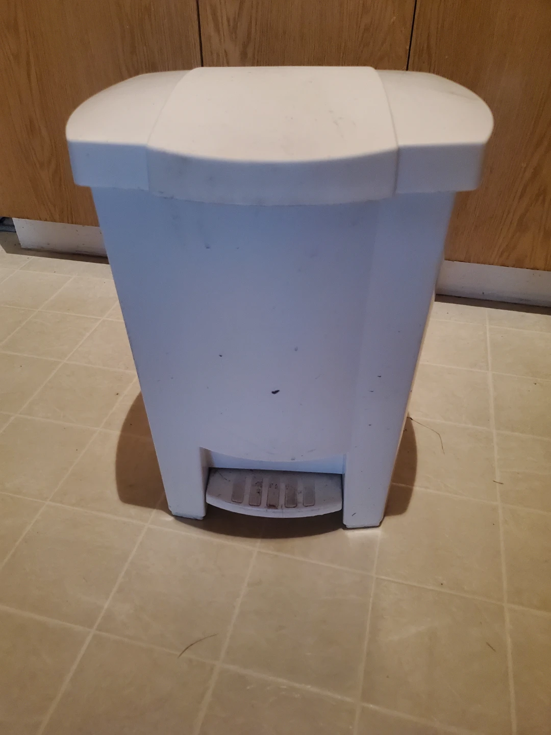 White plastic pedal trash bin