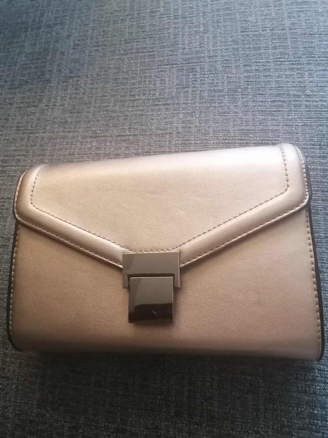 Simons gold clutch purse.