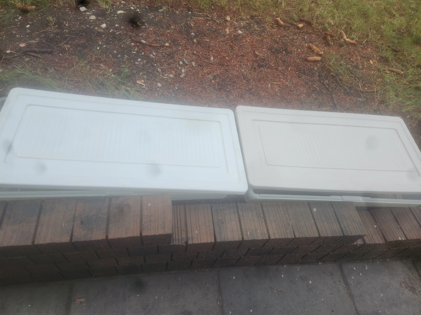 Two White Storage Bins