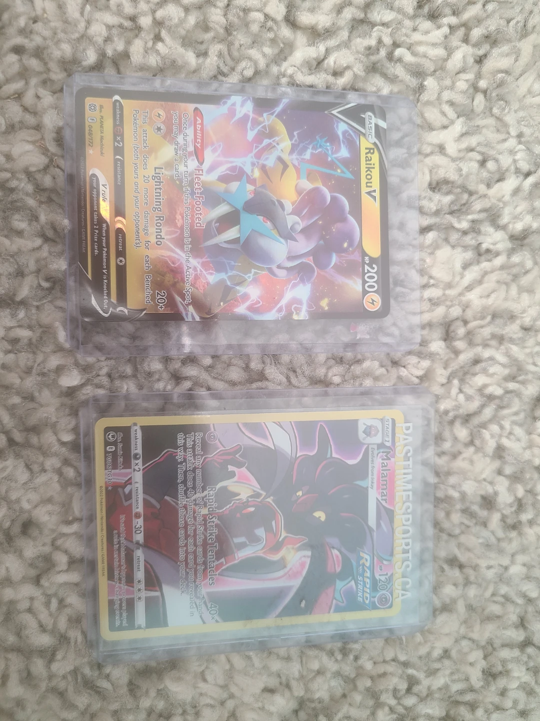 Malamar TG06 and Raikou V Pokemon cards