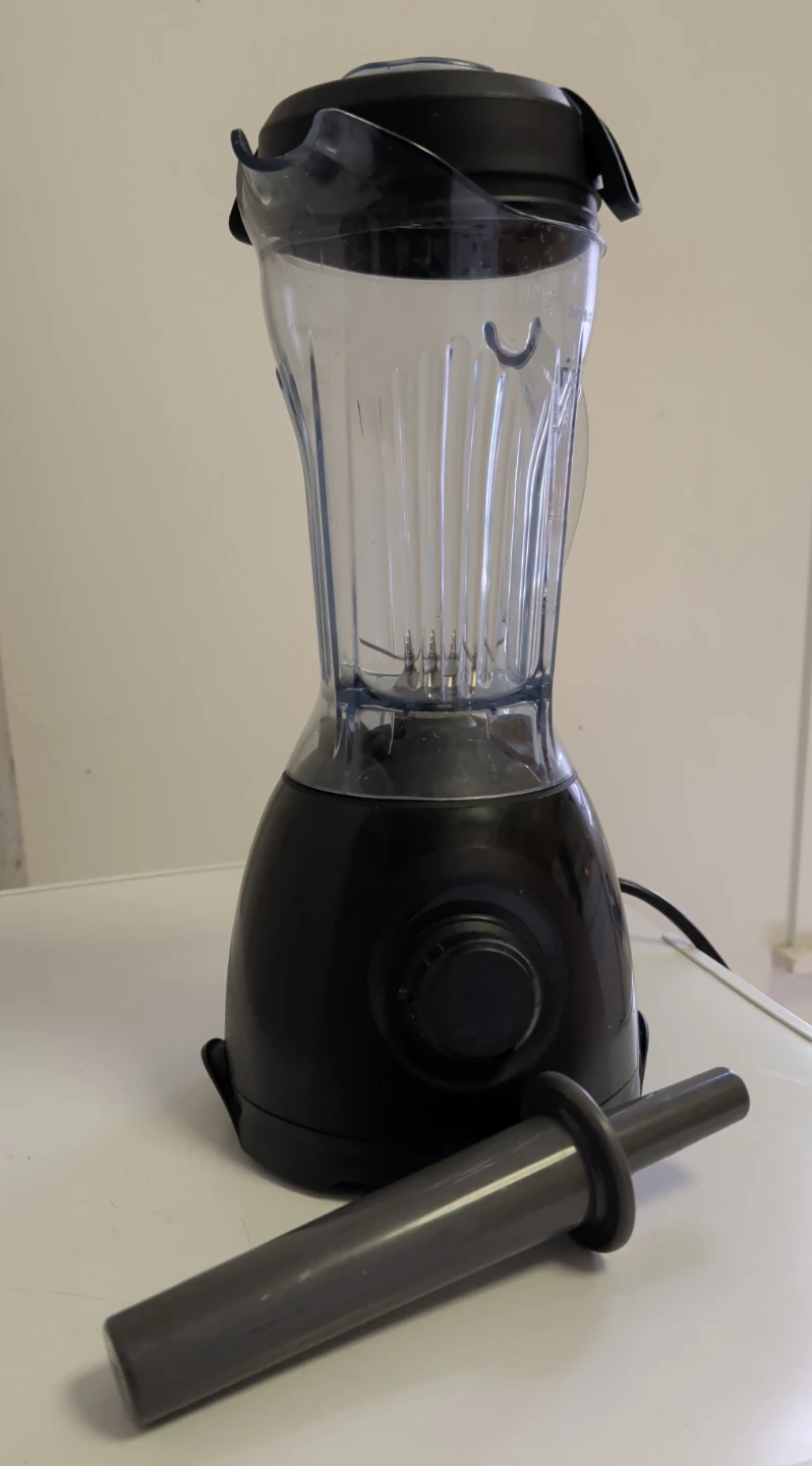 Vitamix ONE Blender with its 32-ounce container and tamper.